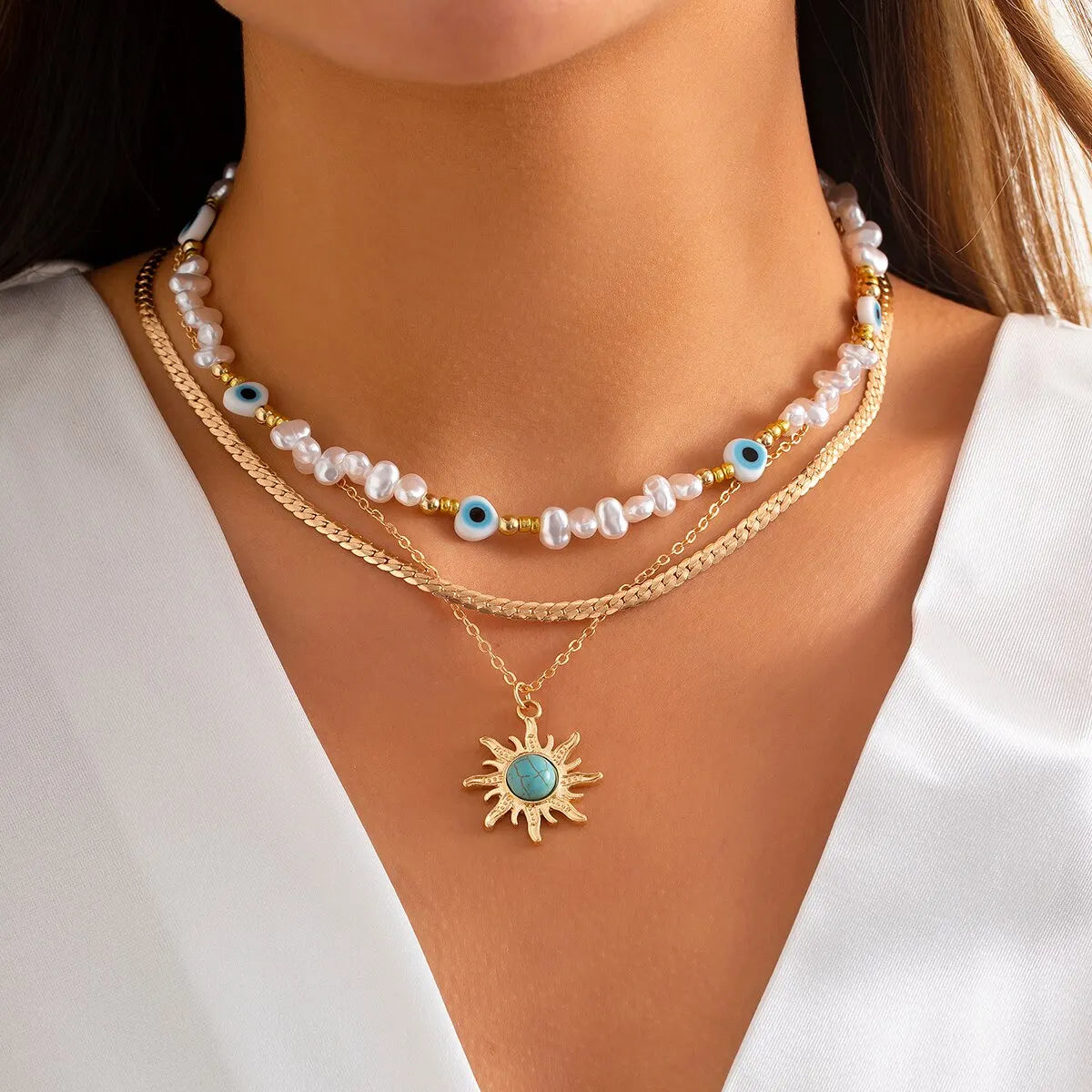EthnoCharm Necklace Set – Zonnebloem & Boze Oog Accessoires